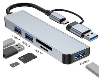 A silver USB hub with multiple ports and card slots, along with various USB drives and memory cards, is displayed against a white background.
