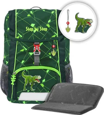 A green backpack with dinosaur graphics and accessories, along with a separate padded seat.
