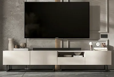 A modern TV stand with a large television mounted above it.