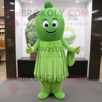Productafbeelding van Selderij mascotte REDBROKOLY kostuum karakter gekleed met een hemdjurk en armbandhorloges