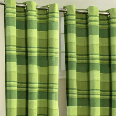 Two green striped curtains hanging on a rod.