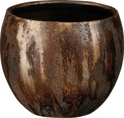 A close-up studio shot of a decorative pot.