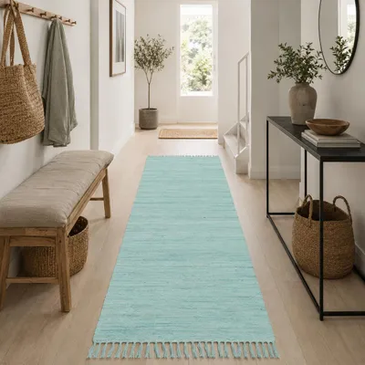 Immagine prodotto di Tappeto in cotone naturale Jolly Cotone blu, dimensioni: 70x140 cm, Immagine generata dall'IA