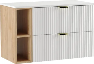 A white and wood-tone cabinet with fluted drawer fronts and gold handles, shown against a white background.