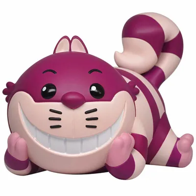 A stylized figurine of the Cheshire Cat from Alice in Wonderland, lying down.