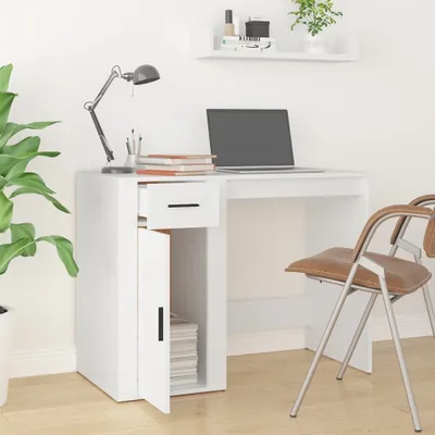 A white desk with a laptop, lamp, and chair.