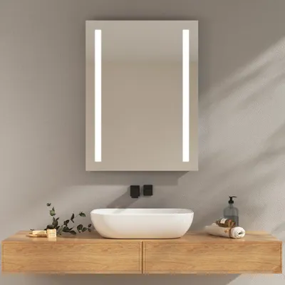 A modern bathroom vanity with a vessel sink, a mirror with LED lighting, and a wooden countertop.