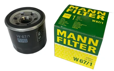 A new Mann Filter oil filter and its packaging are displayed on a white background.