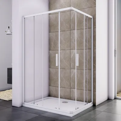 A modern shower cabin with glass doors and a white base, set in a bathroom with tiled walls and dark floor tiles.