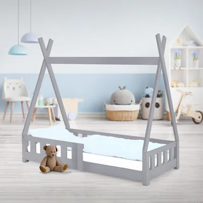 A child's teepee-style bed in a nursery or playroom setting.