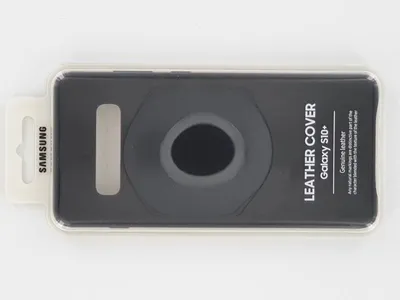 A Samsung leather cover for a Galaxy S10+ phone is displayed in its retail packaging.