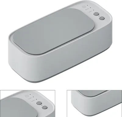 A product shot of a white ultrasonic cleaner with a gray lid and control panel.