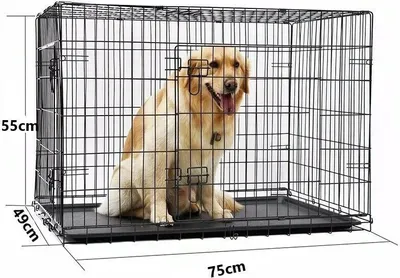 A golden retriever dog sits inside a black metal dog crate. Dimensions are shown with measurement lines and numbers.