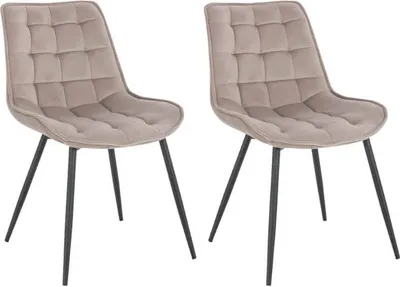 Two beige upholstered dining chairs with black metal legs are shown against a white background.