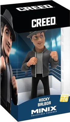 A collectible figurine of Rocky Balboa from the movie Creed, displayed in its packaging.