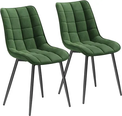 Two green upholstered chairs with black metal legs are shown against a white background.
