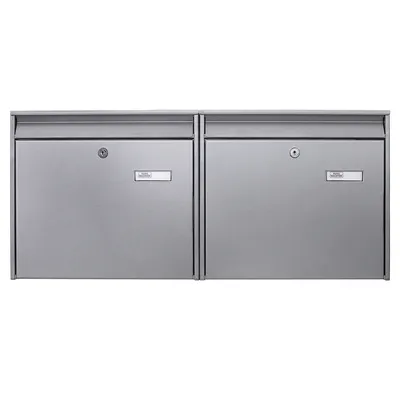 Two silver mailboxes are shown side-by-side against a white background.