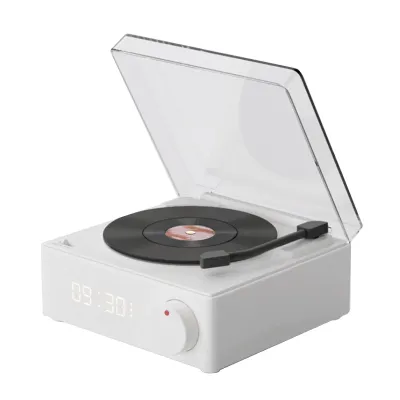A white Bluetooth speaker designed to look like a record player, shown with its lid open and a record on the turntable.