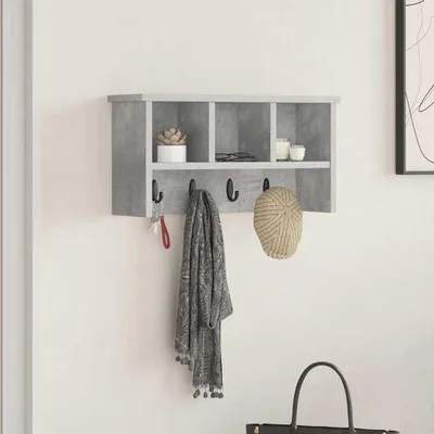 A wall-mounted shelf with hooks, displaying a plant, glasses, candles, a scarf, and a hat.