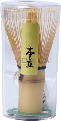 A matcha whisk (chasen) in its packaging.