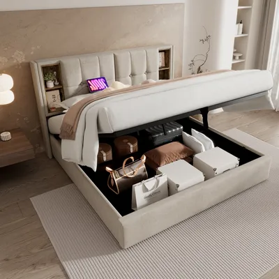 A bed with its storage compartment open, revealing various items inside, in a bedroom setting.