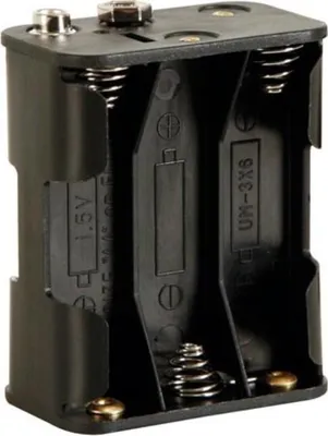 A black battery holder for six AA batteries.