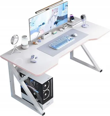 A white gaming desk with a computer, monitor, keyboard, and accessories.