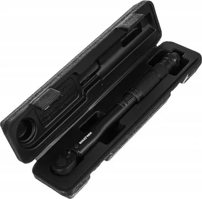 A black torque wrench is shown inside its black carrying case.