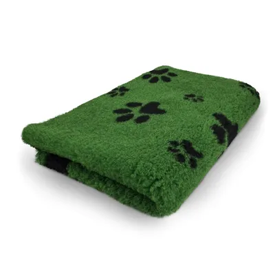A folded green blanket with black paw prints on it, placed on a white background.
