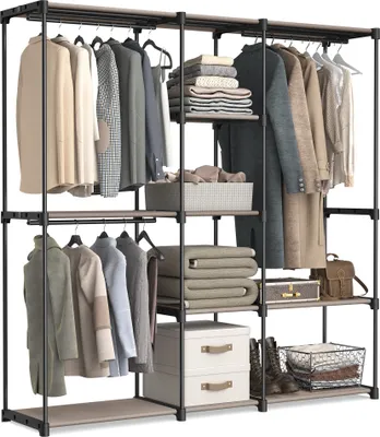 A freestanding wardrobe with multiple shelves and hanging rods, filled with clothing and storage boxes.