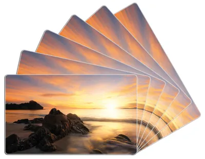 Produktbild von Wallario Frühstücksbrettchen 6er Set aus Glas, je 14 x 23 cm, mit rutschfesten Füßen, Motiv Sonne über dem Meer mit Felsenlandschaft