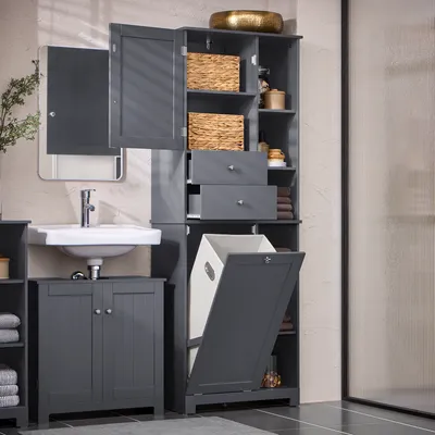 A bathroom vanity with a sink and a tall cabinet with a laundry hamper.