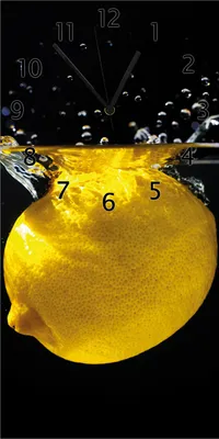 Produktbild von Wallario Design Wanduhr bedruckt, Größe 30 x 60 cm, Motiv: Zitrone im Wasser - Frisches Obst für die Küche