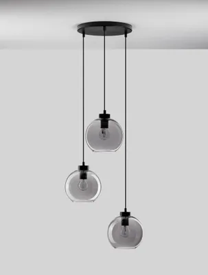 A modern pendant light fixture with three glass globes hanging from a black ceiling mount.