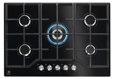 A top-down view of a black gas stovetop with five burners, one of which is lit with a blue flame.