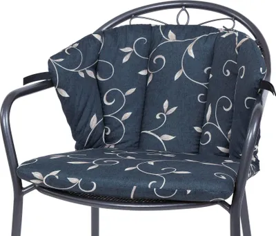 A close-up view of a chair cushion with a floral pattern.