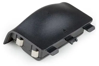 A black battery pack for an Xbox controller, shown from a slightly elevated angle against a white background.