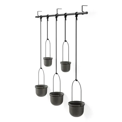 A set of five hanging planters suspended from a black rod against a white background.