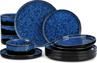 A set of blue and black ceramic tableware is arranged on a white background.