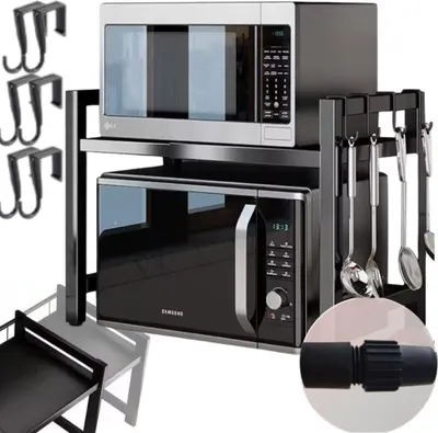 A kitchen organizer rack holding two microwaves, with various kitchen utensils hanging from the side.