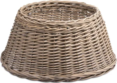 A wicker tree skirt on a white background.