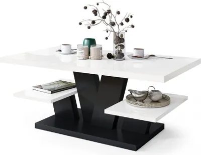 A modern coffee table with a white glossy top and a black base with shelves.