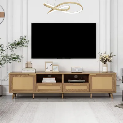 A TV stand with a rattan design in a living room setting.