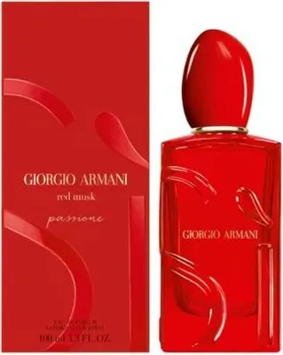 A red perfume bottle and its packaging are displayed against a white background.