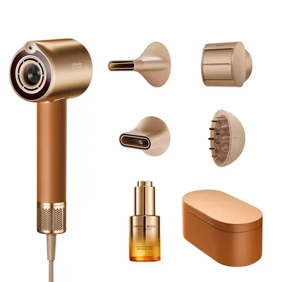 A collection of hair care products and accessories, including a hairdryer, attachments, a bottle of serum, and a storage case, all presented against a white background.
