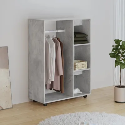 A wardrobe with clothes hanging on a rack and shelves with folded clothes and a basket.