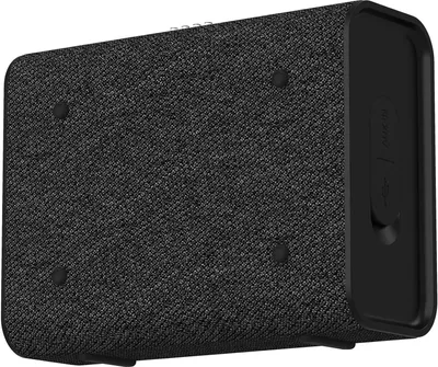A close-up, side view of a black and gray Grundig Bluetooth speaker.