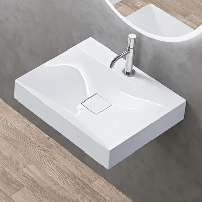 A modern white washbasin with a chrome faucet is mounted on a gray tiled wall, with a wooden floor below.