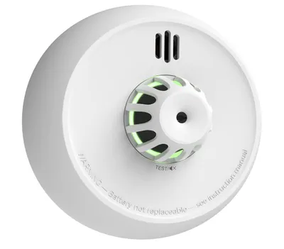 A white smoke detector with a green light ring and a test button.