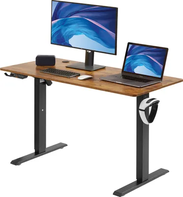 A standing desk with a monitor, laptop, keyboard, and mouse.